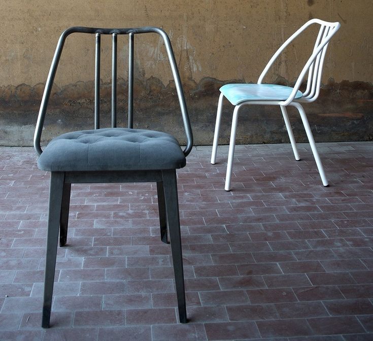 Stylish Chair Pairing: Modern Minimalism Meets Playful Elegance for Inviting Cafe Atmosphere