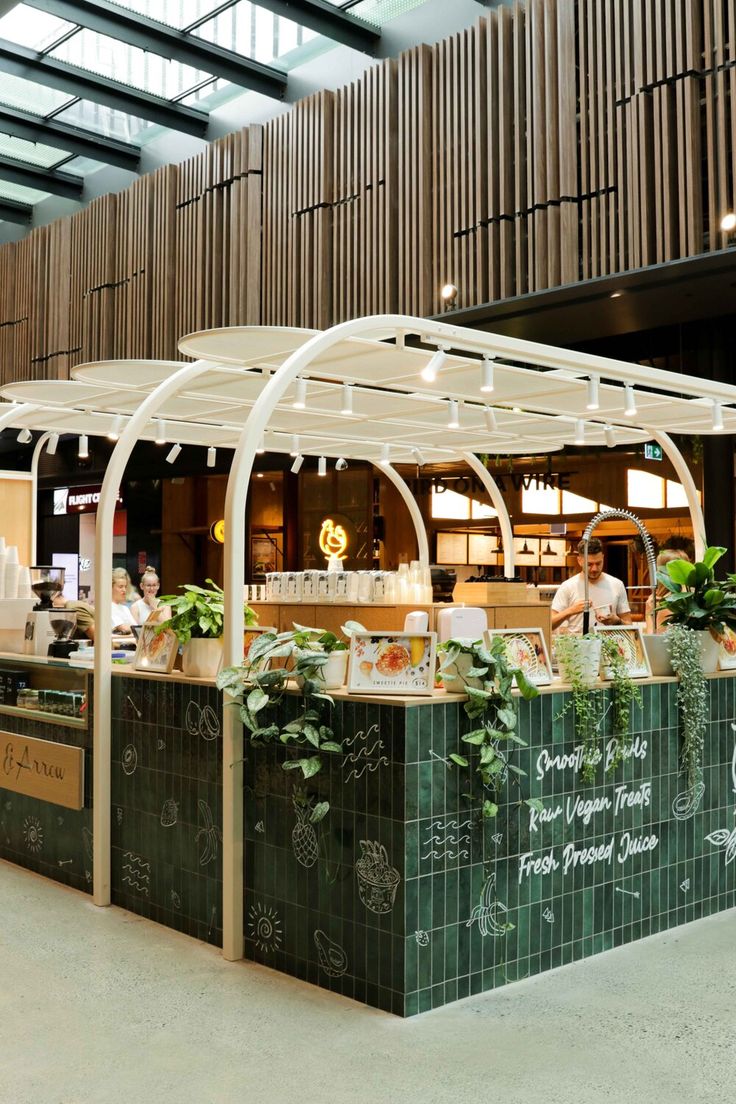 Inviting Modern Cafe Design Blends Contemporary Aesthetics with Nature for Health-Conscious Patrons