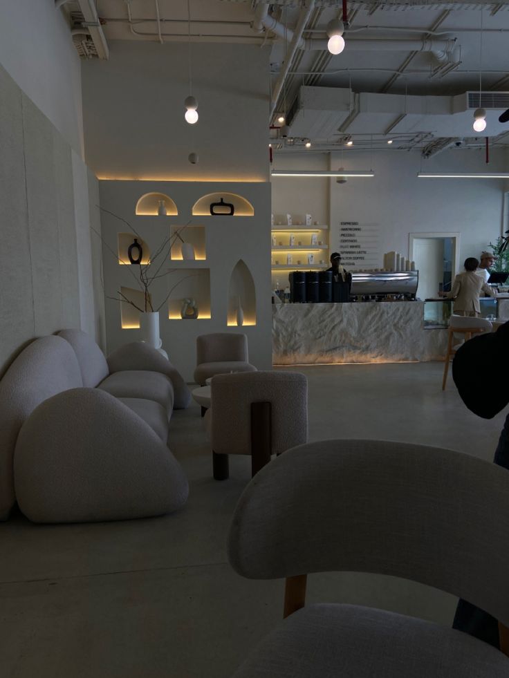 Modern Minimalist Cafe Design: A Welcoming Atmosphere with Comfort and Artistic Touches