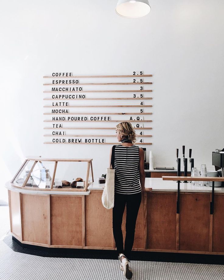 Modern Minimalist Cafe Design: Inviting Space with Natural Light and Warmth