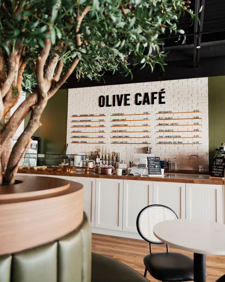 Modern Cafe Design Blends Natural Elements with Sleek Finishes for Inviting Atmosphere