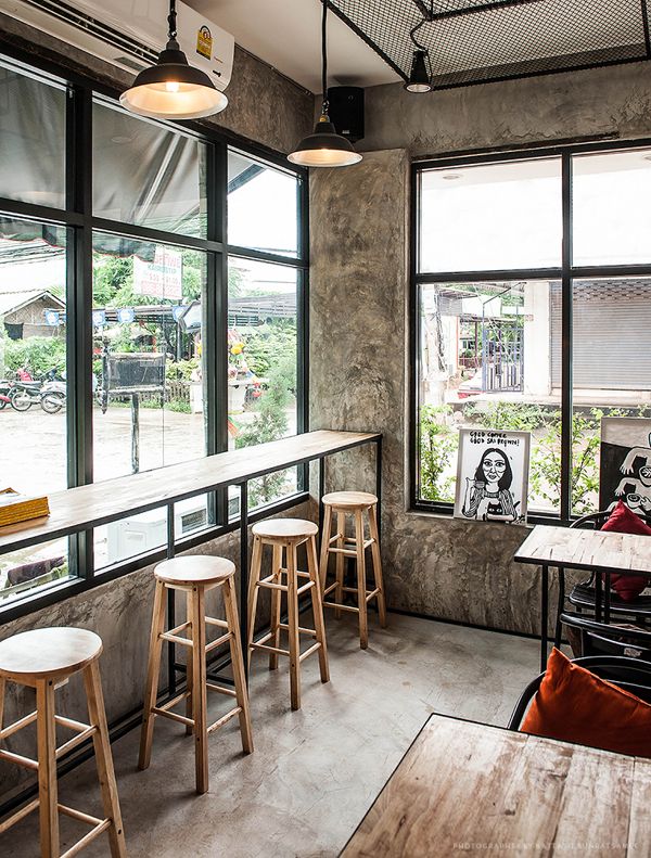 Modern Cafe Blends Industrial Minimalism with Inviting Atmosphere and Natural Light