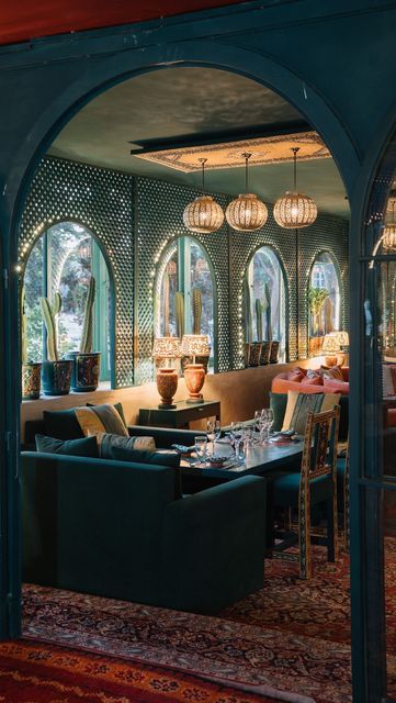 Vibrant Cafe Design: A Cozy Oasis of Rich Greens, Eclectic Decor, and Inviting Atmosphere