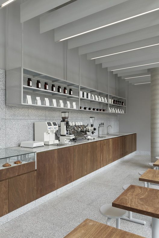 Modern Cafe Design Blending Wood and Stone for a Sophisticated Aesthetic