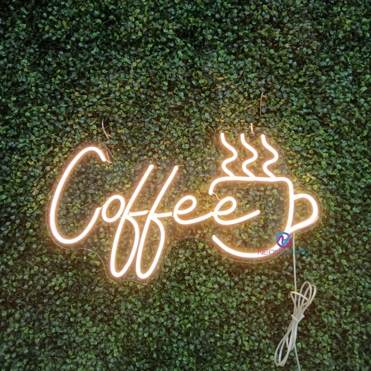 Vibrant Neon Sign Enhances Cozy Cafe Atmosphere Amidst Lush Greenery