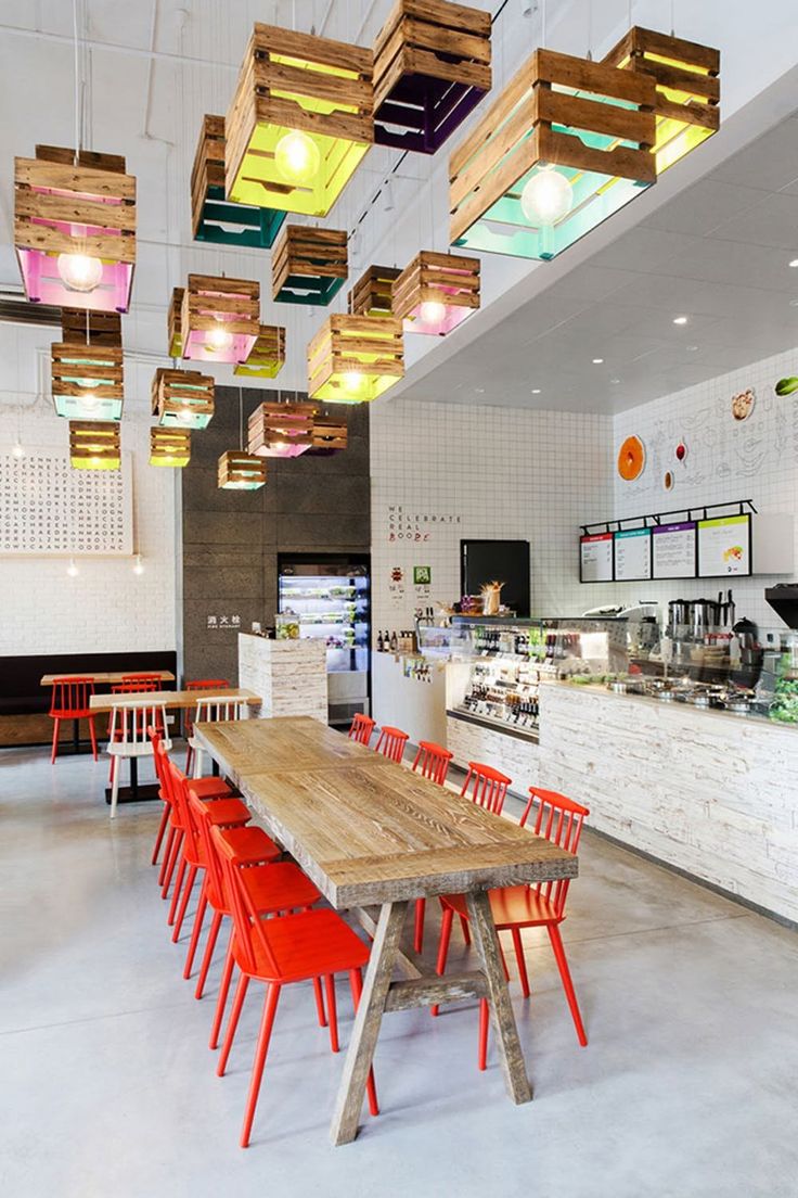 Bright and Inviting Cafe with Modern Aesthetics and Playful Design Elements