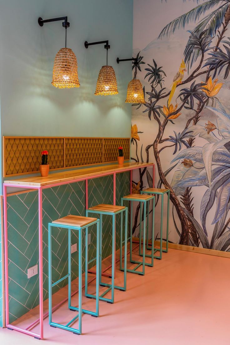 Vibrant Cafe Design Blends Pastel Colors, Botanical Murals, and Contemporary Furnishings for an Inviting Atmosphere