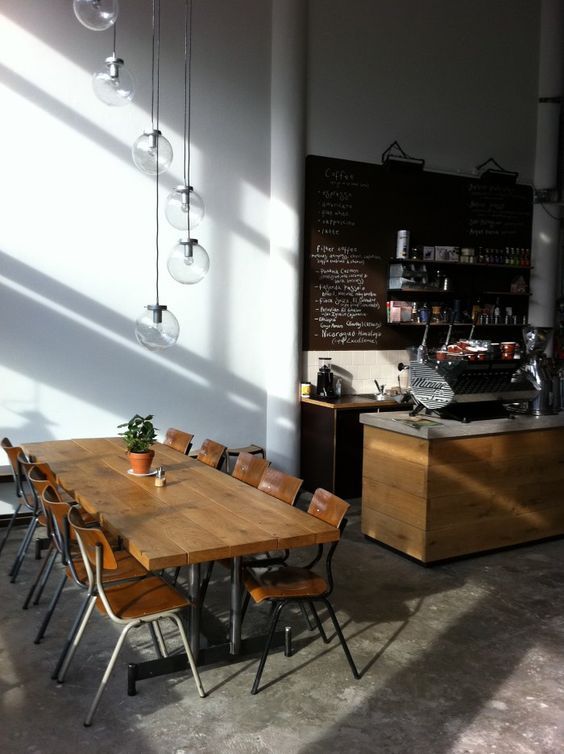 Modern Minimalist Cafe Design: Inviting Light, Communal Seating, and Chic Coffee Bar