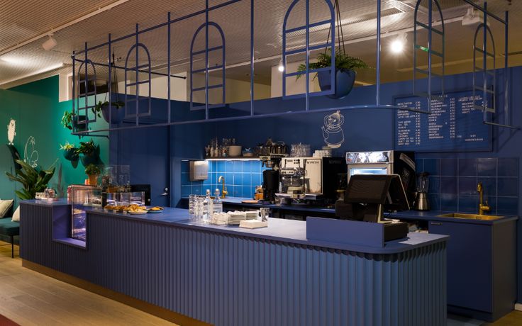 Vibrant Cafe Design: Striking Blue Palette with Textured Counter and Inviting Atmosphere