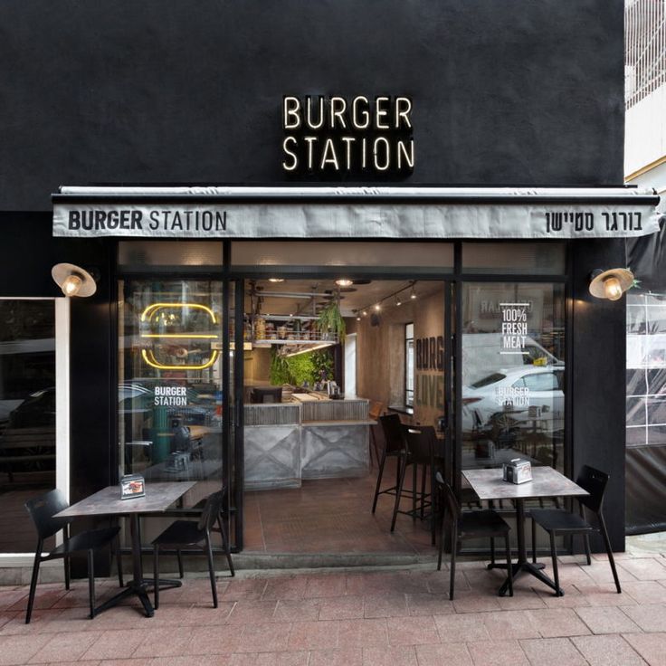 Modern Cafe Design Blends Sleek Exterior with Inviting Industrial Interior