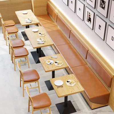 Modern Cafe Design: A Welcoming Atmosphere with Cozy Wood and Leather Accents