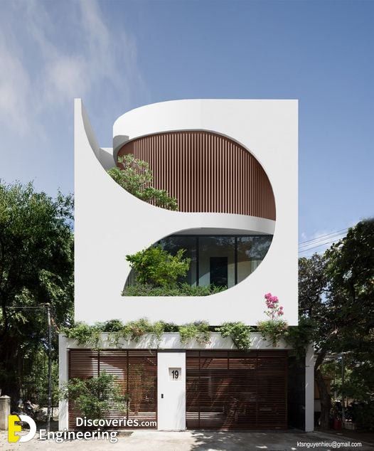 Modern Cafe Design: Bold Curvilinear Facade, Natural Light, and Harmonious Greenery