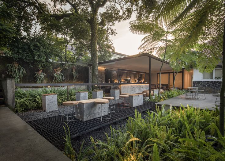 Tranquil Cafe: A Harmonious Blend of Natural and Modern Design Amidst Lush Greenery