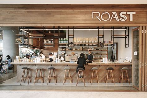 Warm and Inviting Cafe Design Blending Rustic Wood Elements with Modern Accents