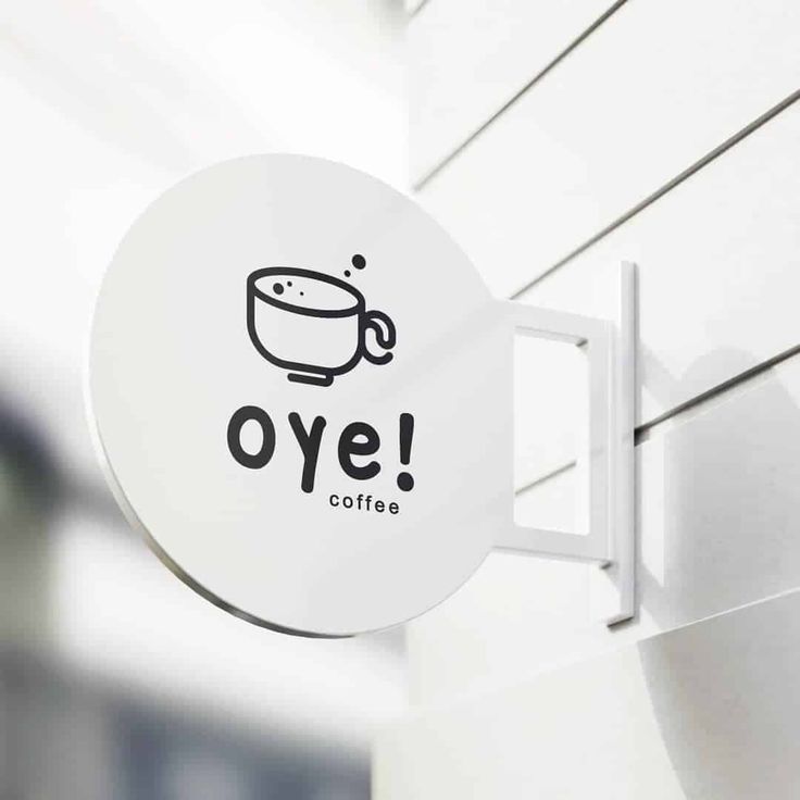 Minimalist Circular Sign Design Elevates Cafe's Inviting Atmosphere with Stylish Coffee Graphics