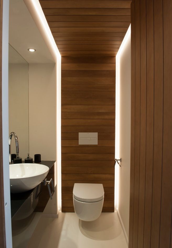 Modern Cafe Restroom: A Stylish Retreat with Warm Wood Elements and Sleek Minimalism