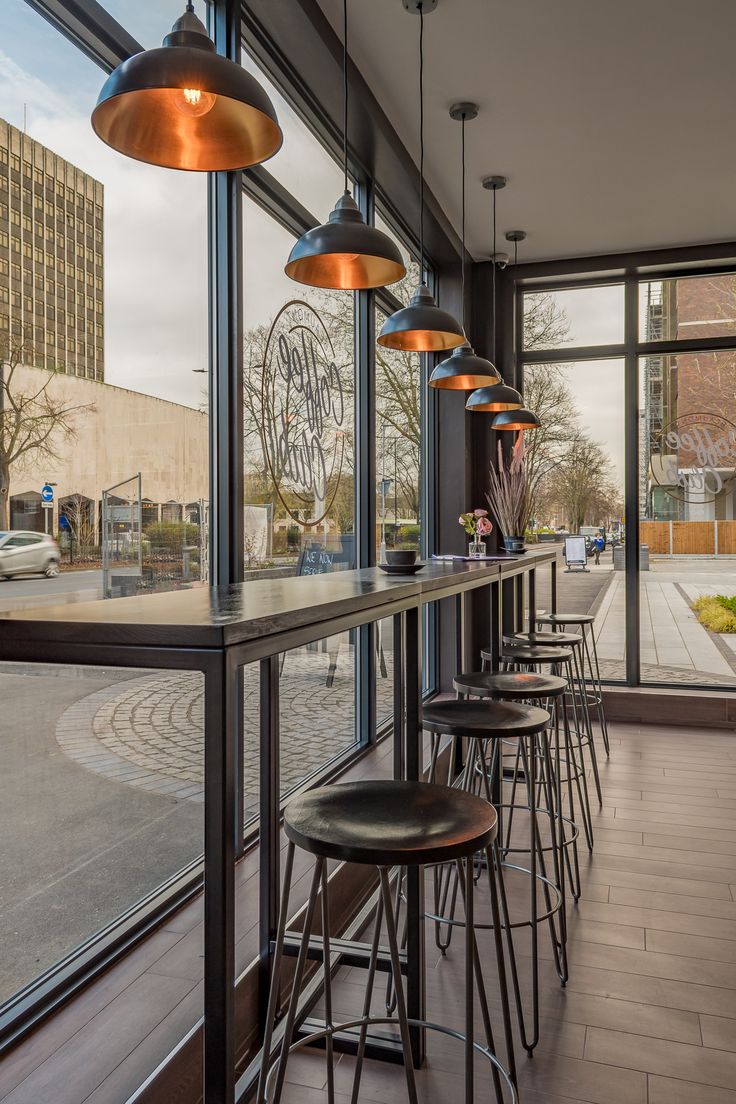 Modern Cafe Design with Natural Light and Elegant Industrial Accents