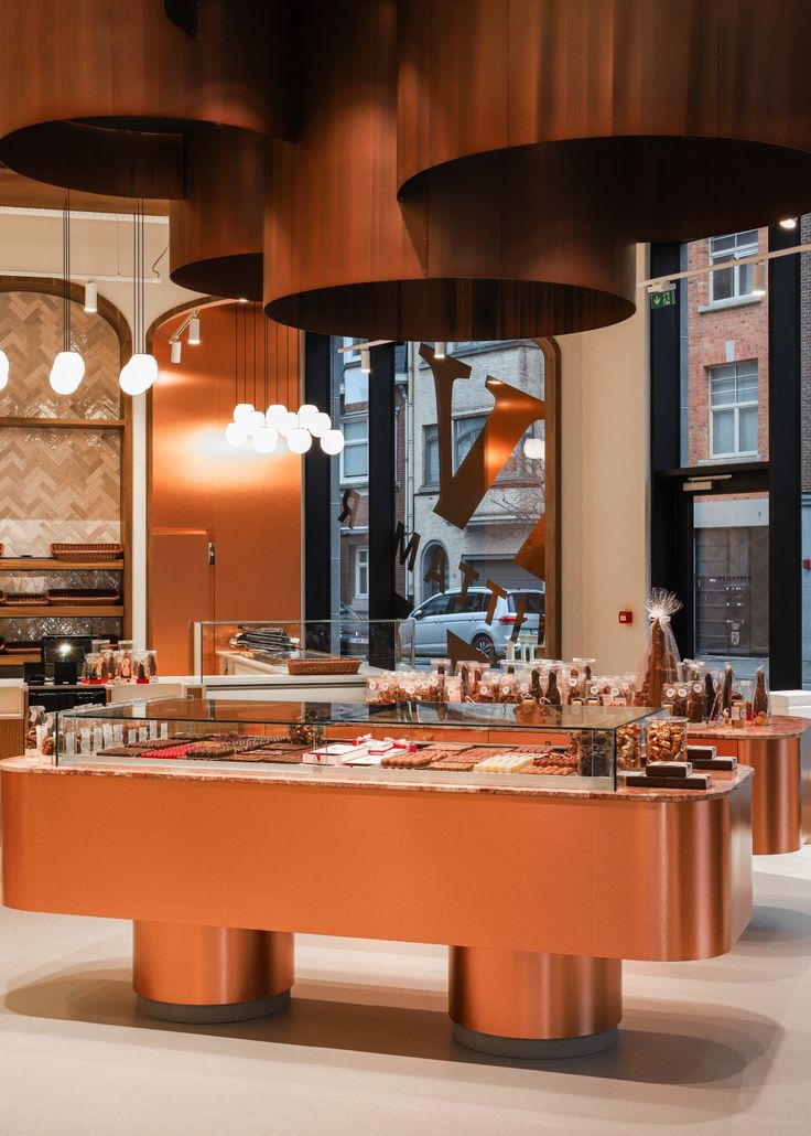 Modern Cafe Design: Elegant Rounded Shapes, Warm Copper Palette, and Inviting Ambiance