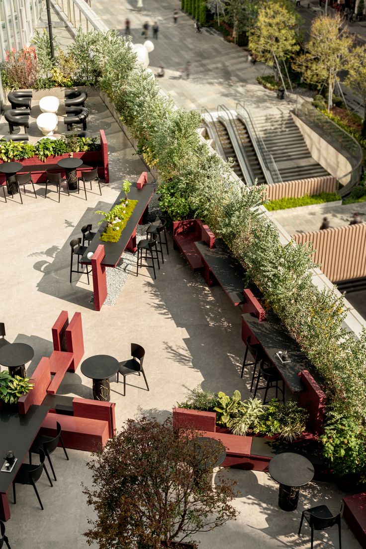 Chic Cafe Design Blends Nature and Modern Aesthetics with Inviting Outdoor Terrace and Social Seating Arrangements