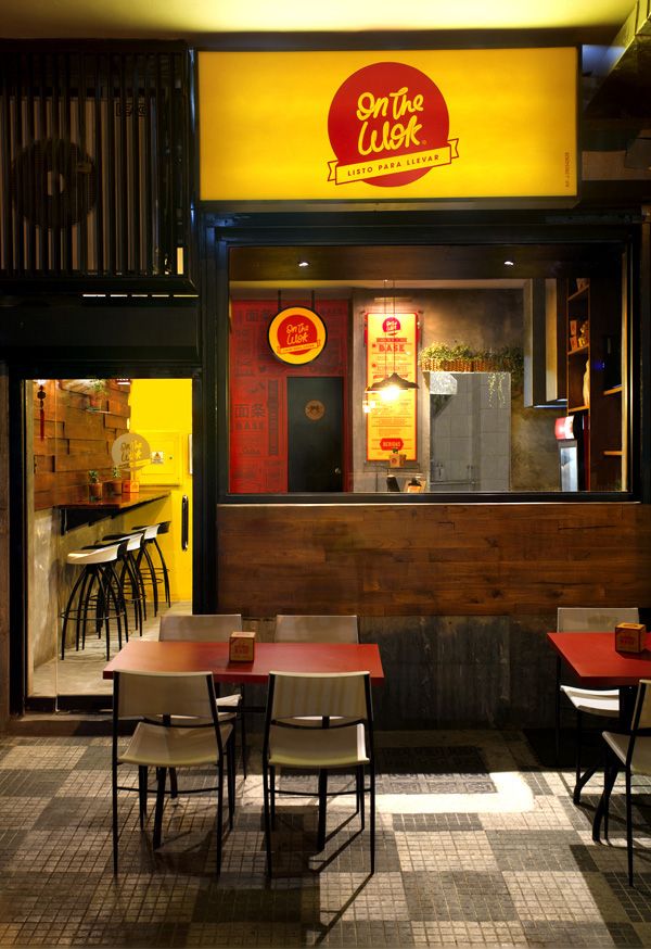 Modern Cafe Boasting Warm Wooden Accents and Vibrant Yellow Hues for a Cheerful Atmosphere