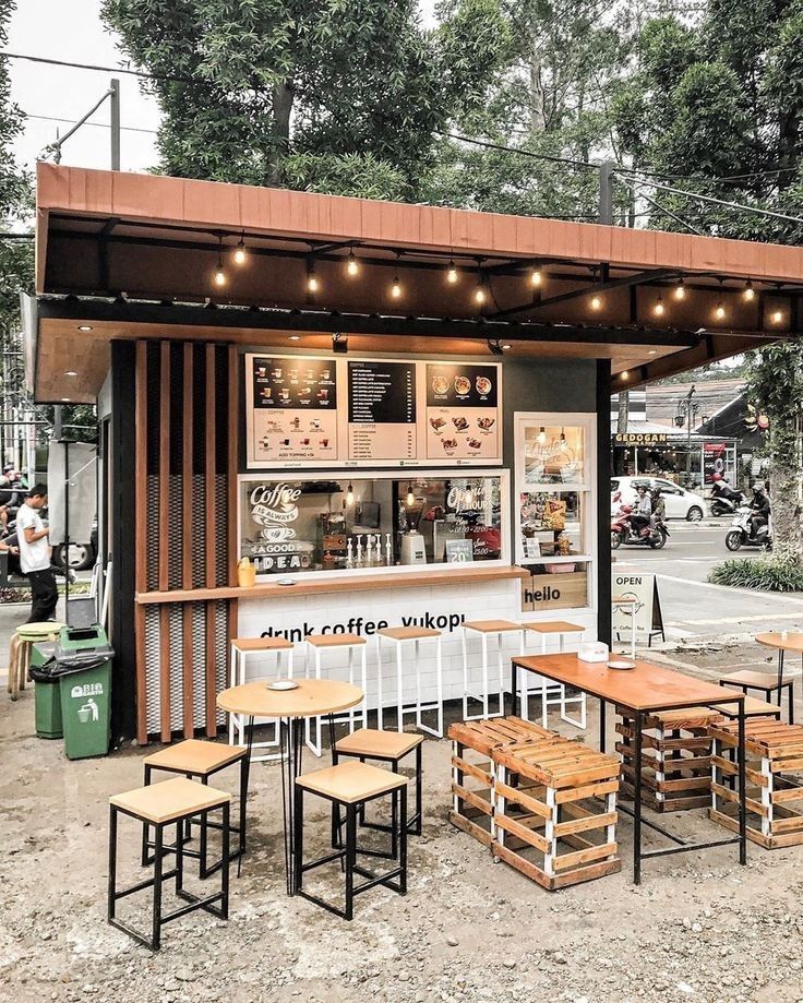 Modern Minimalist Cafe Design with Warm Wooden Accents and Inviting Outdoor Seating