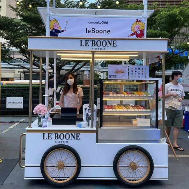 Elegant Food Cart Design Enhances Cafe Atmosphere with Whimsical Charm and Functionality