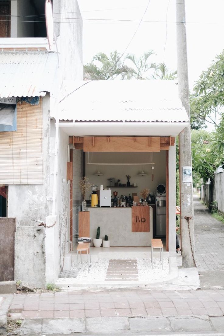 Modern Minimalist Cafe Design with Inviting Indoor-Outdoor Flow and Natural Elements