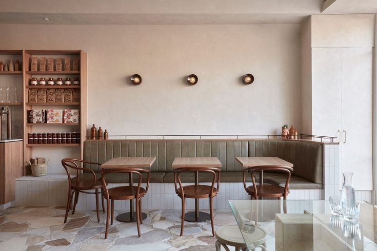 Minimalist Cafe Design: A Serene Aesthetic with Cozy Seating and Warm Accents