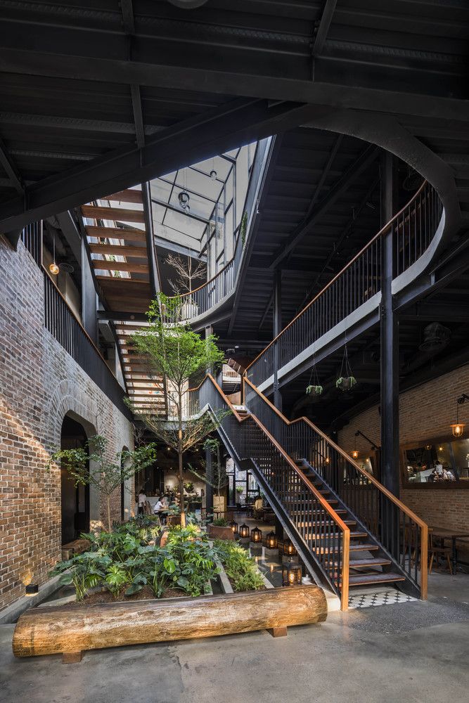 Elegant Cafe Design Merges Industrial and Natural Elements for Inviting Versatility