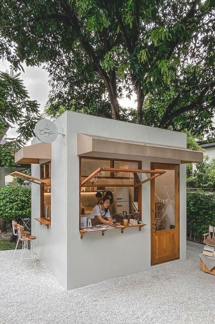 Modern Minimalist Cafe with Inviting Atmosphere and Serene Outdoor Seating