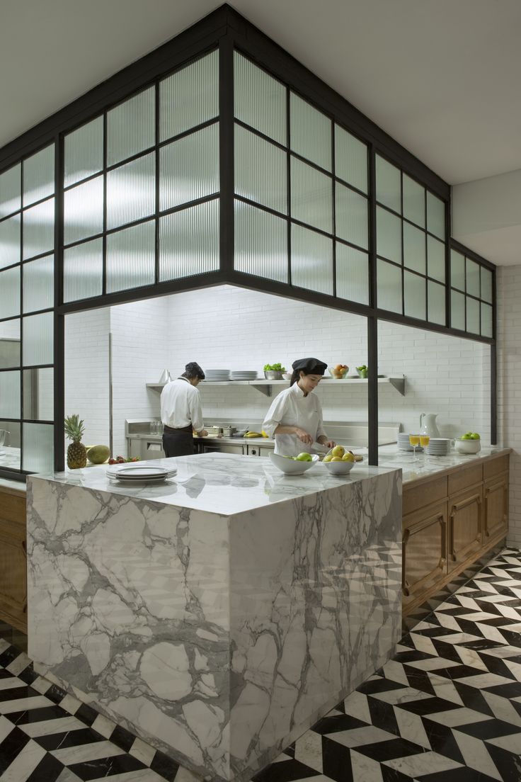 Modern Cafe Design: Elegant Open Kitchen with Marble Island and Bright Aesthetic