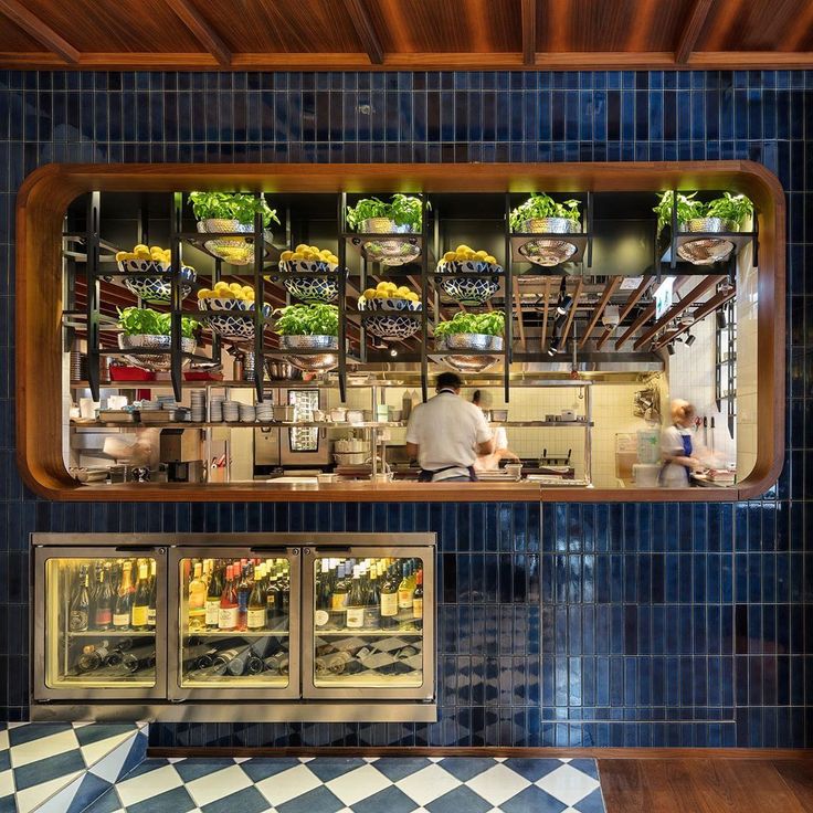 Contemporary Cafe Design: Open Kitchen, Blue Tiles, and Lively Greenery Create an Inviting Atmosphere