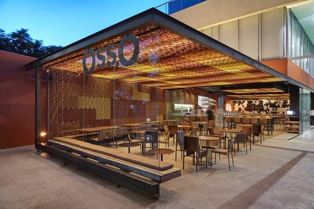 Modern Cafe Design with Open Structure, Inviting Atmosphere, and Seamless Integration into Surroundings