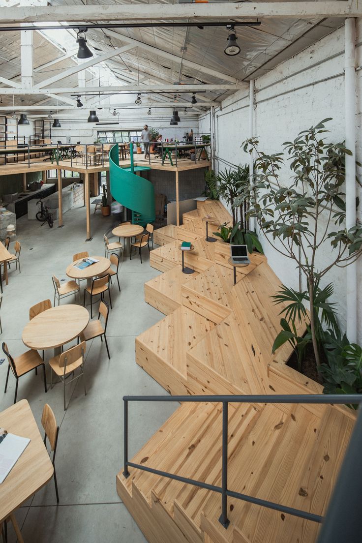 Inviting Cafe Design Blends Industrial Style with Natural Elements and Community Vibes