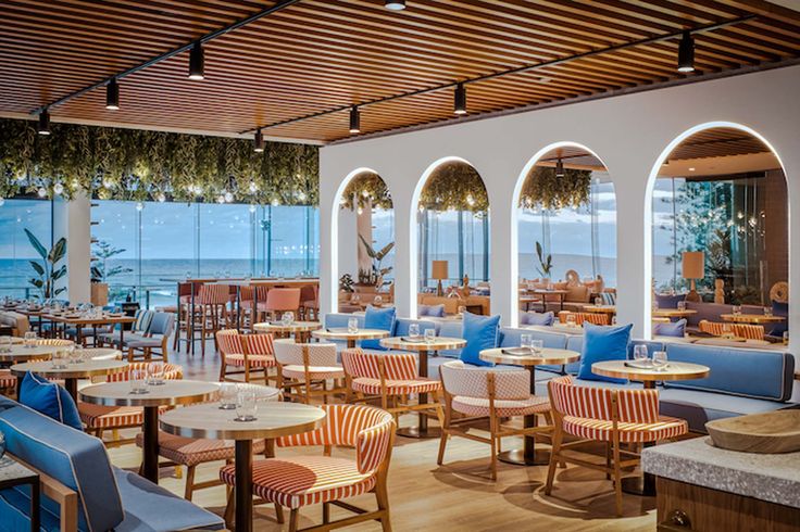 Modern Cafe with Ocean Views: A Stylish, Inviting Space Blending Natural Elements and Contemporary Design