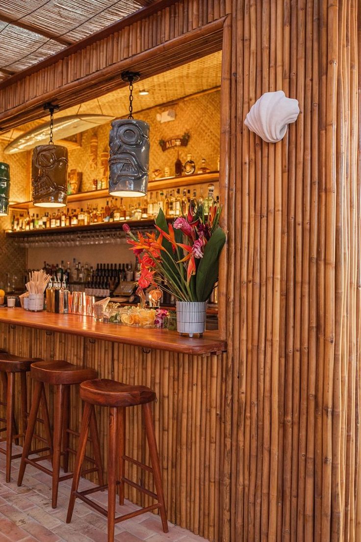 Tropical-Inspired Cafe Design: A Warm Ambiance with Natural Materials and Vibrant Floral Accents