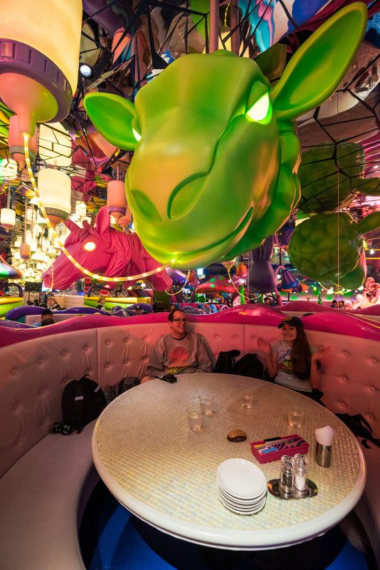 Whimsical Cafe Design with Playful Sculptures and Vibrant Decor Creates a Unique Dining Experience