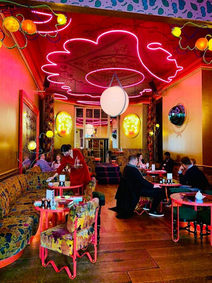 Eclectic Cafe Design Featuring Bold Colors and Playful Decor Creates Inviting Atmosphere