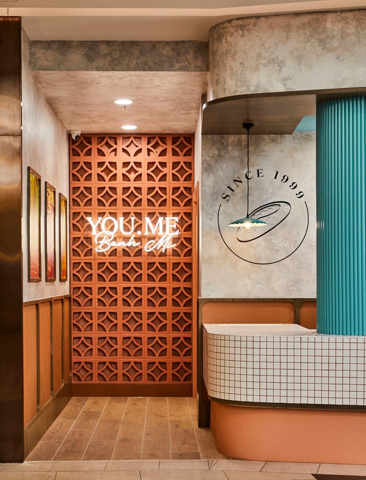 Inviting Cafe Design with Vibrant Terracotta Walls and Modern Aesthetic Elements