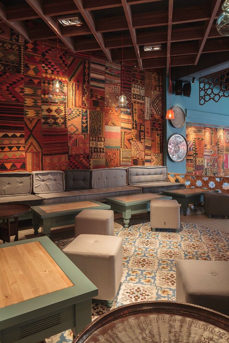 Vibrant Cafe Interior Combines Eclectic Design with Comfortable Social Spaces