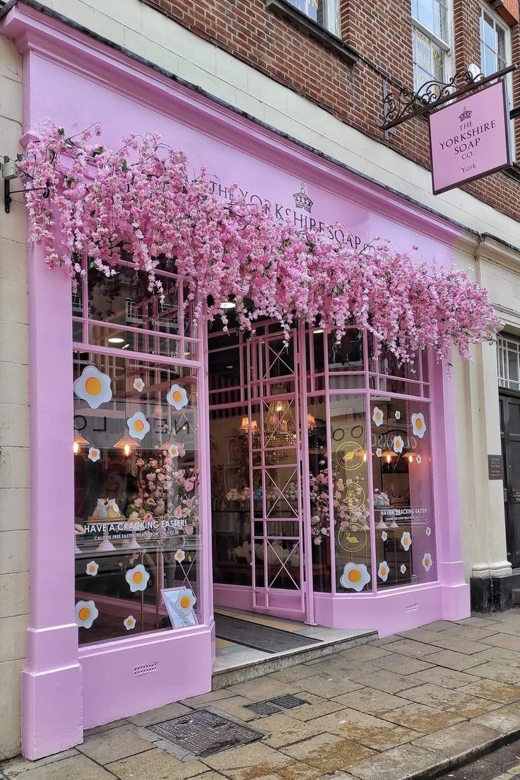 Charming Pink Cafe Beautified with Artificial Cherry Blossoms and Whimsical Decor