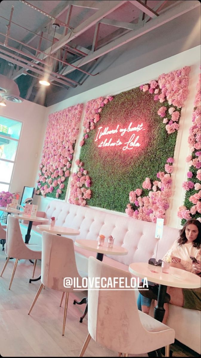 Charming Cafe Design with Floral Wall and Cozy Atmosphere