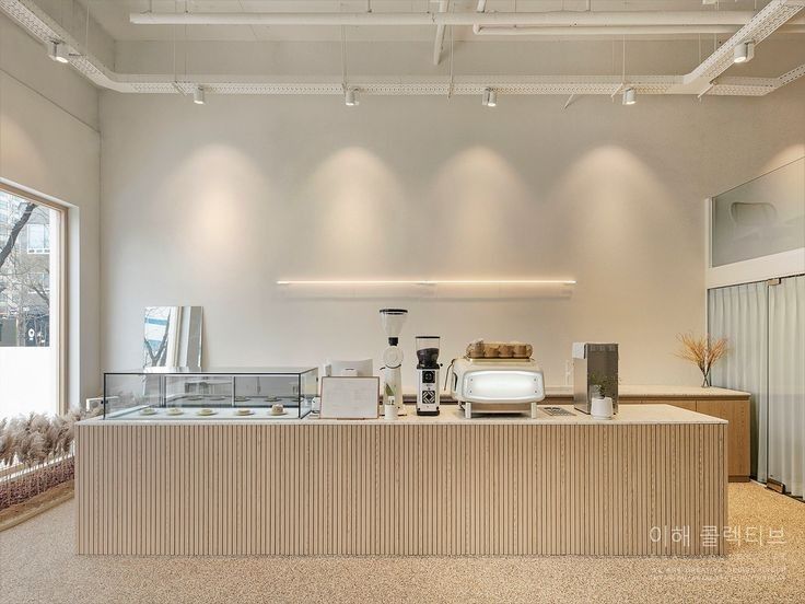 Modern Minimalist Cafe Design: A Calming and Inviting Space with Textured Elements and Natural Light