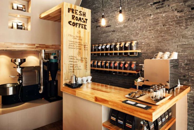 Inviting Cafe Design Blends Rustic Wood Elements with Modern Finishes to Enhance Community and Artisanal Coffee Culture