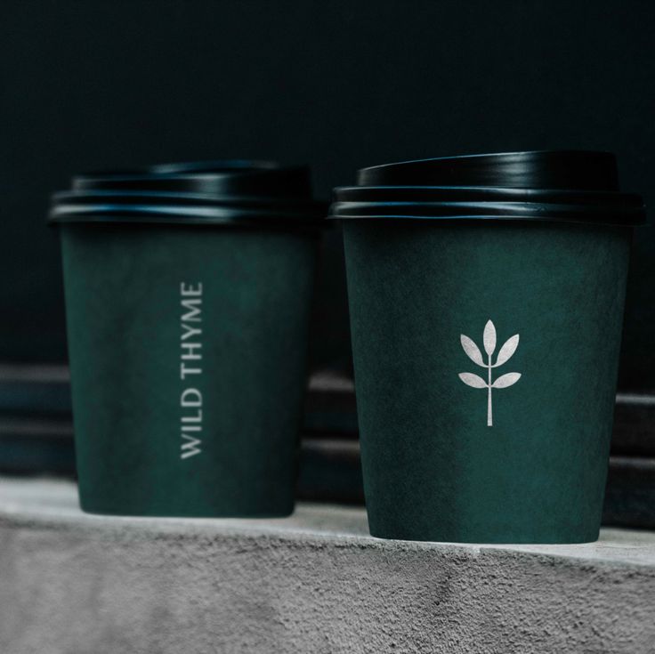 Modern Minimalist Coffee Cup Design: Elegant Aesthetics in Dark Green with Organic Touches