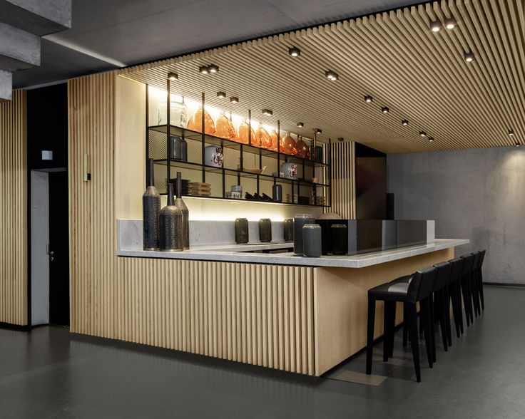 Modern Minimalist Cafe Design with Sleek Bar and Inviting Atmosphere