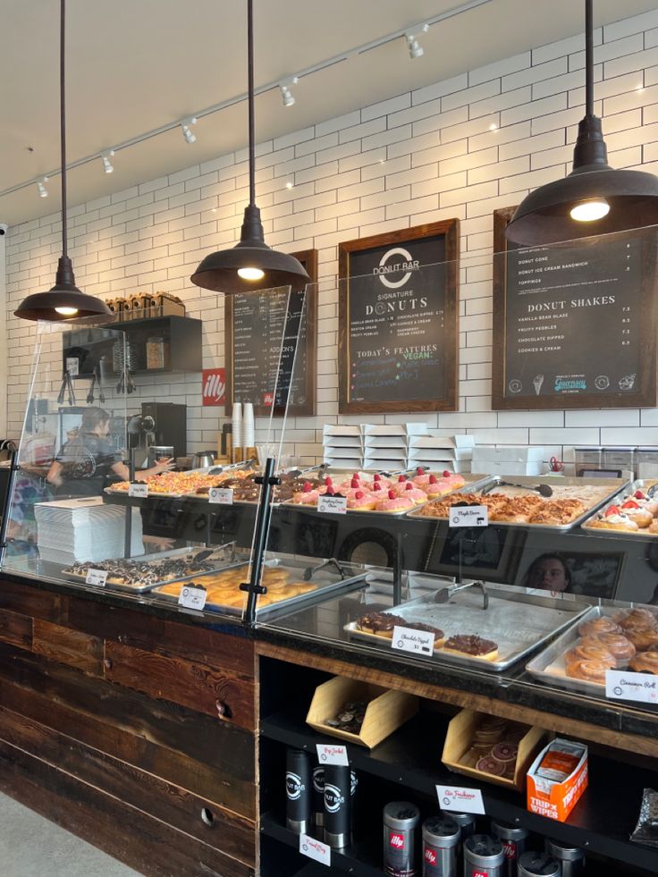 Modern Cafe Design: A Warm and Inviting Space Showcasing Fresh Donuts and Pastries