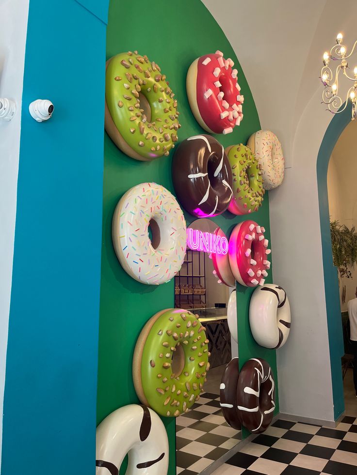 Whimsical Cafe Design Featuring Colorful Faux Donuts and Stylish Decor