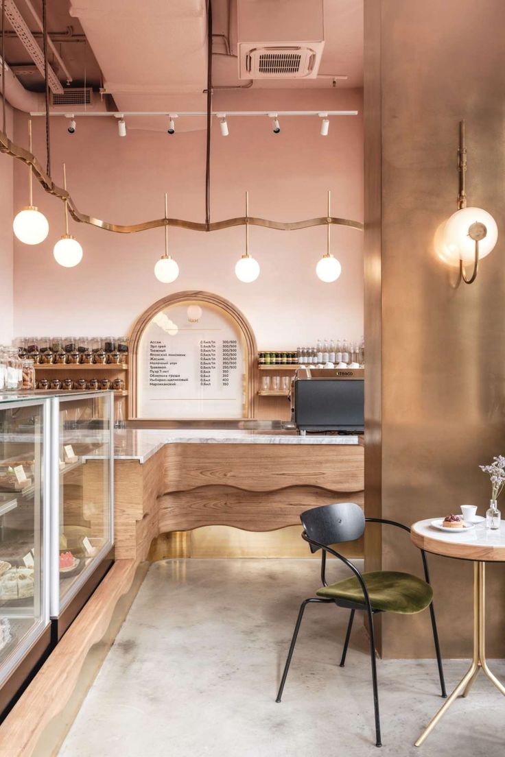 Cafe Design: A Cozy Blend of Warm Materials, Elegant Lighting, and Inviting Spaces