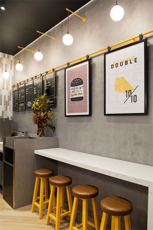 Modern Minimalist Cafe Design with Industrial Elements and Vibrant Accents